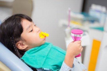 Child receiving fluoride treatment