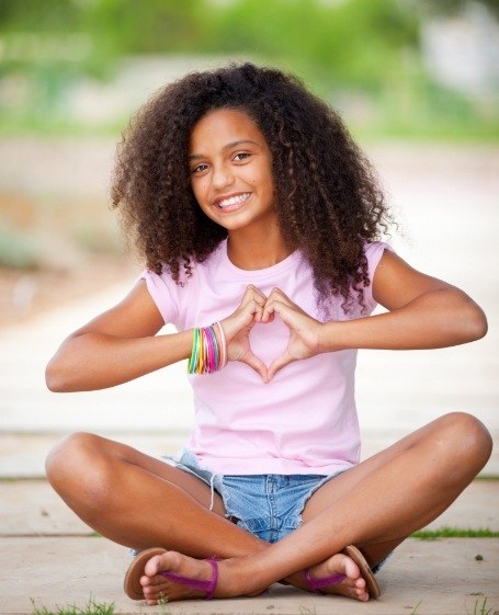 Young child smiling after cosmetic dentistry