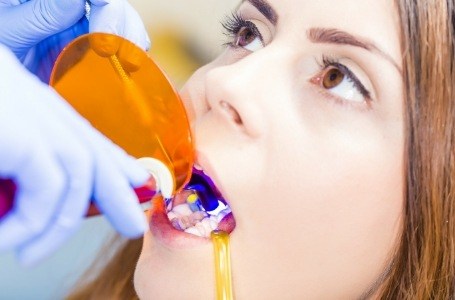 Child receiving dental bonding treatment