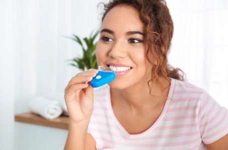 Teen using professional teeth whitening treatment