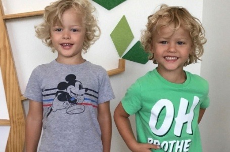 Two young children smiling during dentistry for toddlers