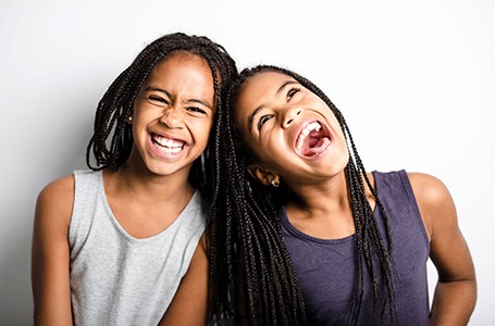 Two young girls smiling in Allen