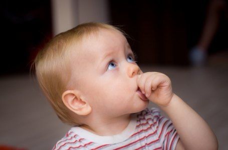 Baby sucking thumb before lip and tongue tie treatment