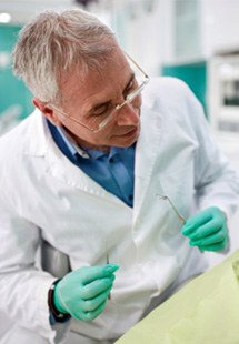 dentist looking at patient 