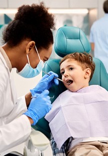 child visiting dentist for checkup 