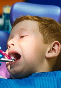 young child getting tooth extractions 