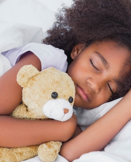 Child relaxing after sedation dentistry