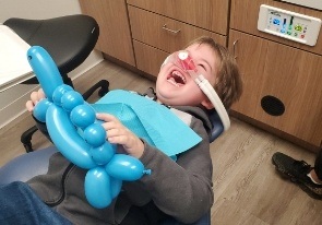 Child relaxing during sedation dentistry visit