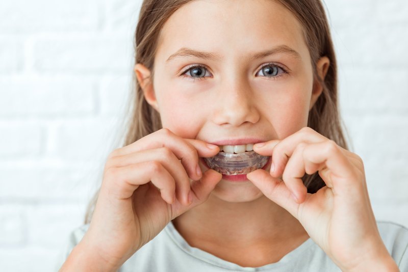 young girl wearing mouthguard